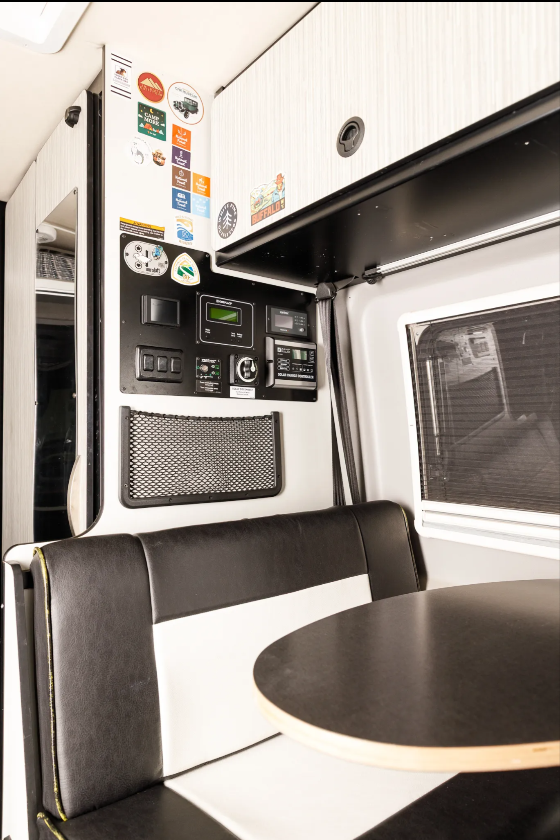 Dinette seating with solar charge controller panel